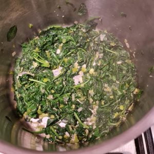 wilted spinach with chopped spring onions