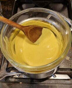 warming the hollandaise sauce over warm water