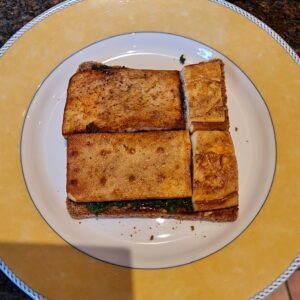 pan fried tofu on the spinach layer