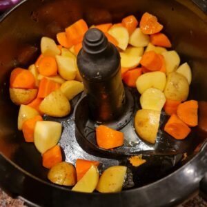 sauteeing the carrots and potatoes together