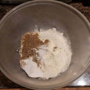 flours, spices & baking powder in pyrex bowl