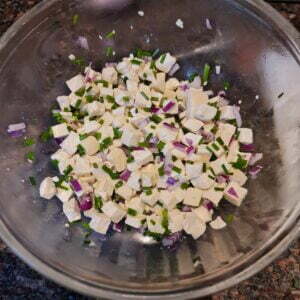 Cubed drained tofu with chives and red onion