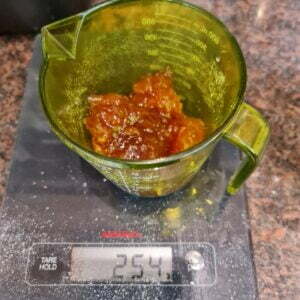 weighing the apricot jam into a jug