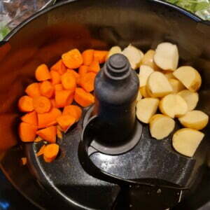 Cooking the potatoes and carrots