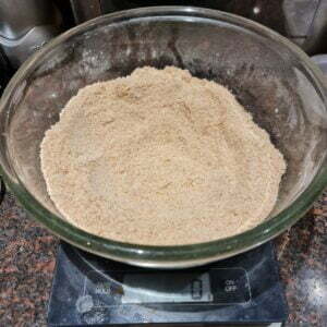 rubbing the fat into the flour until if resembles fine bread crumbs