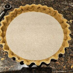lining the pastry case with a circle of paper