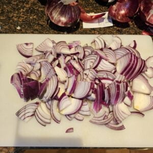 chopping the onions into slivers