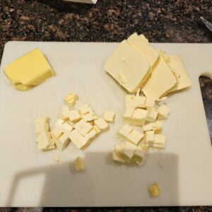 cutting cold margarine into cubes