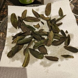 crisped sage leaves on kitchen towel